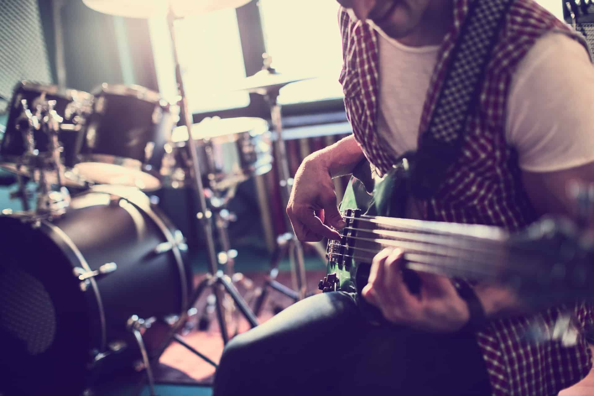 Close up of a man rehearsing in a studio